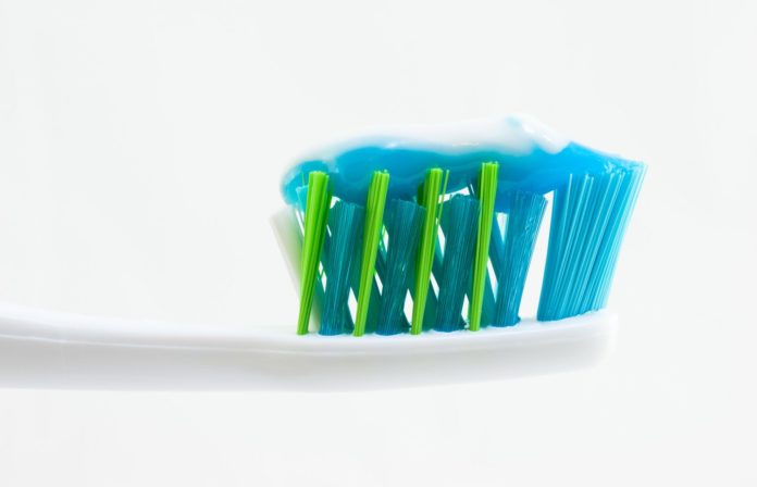 Toothbrush_with_Toothpaste_11693757123-1-696x448.jpg